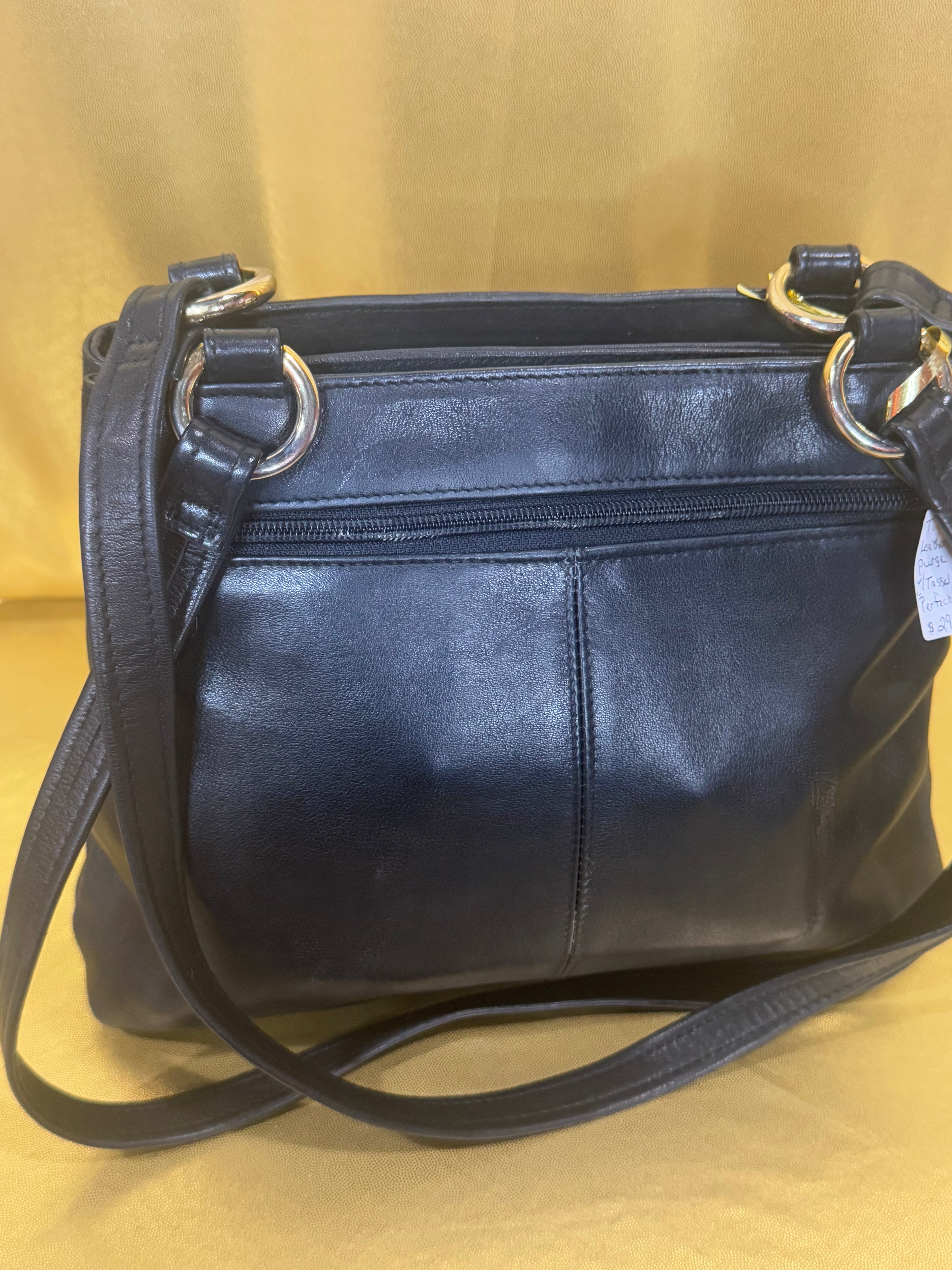 Vintage Tignanello Black Leather Shoulder Bag with Tassel Accent
