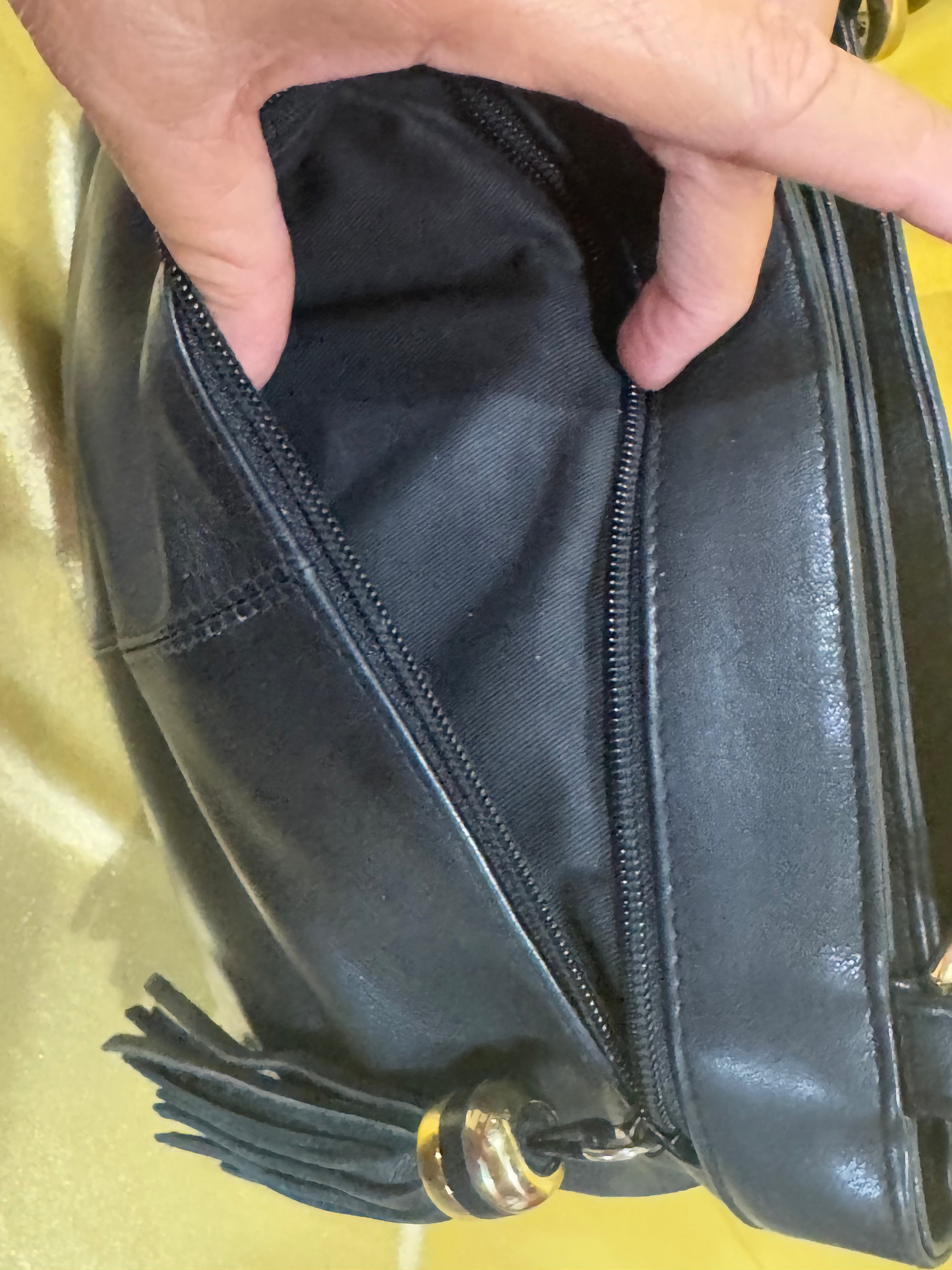 Vintage Tignanello Black Leather Shoulder Bag with Tassel Accent